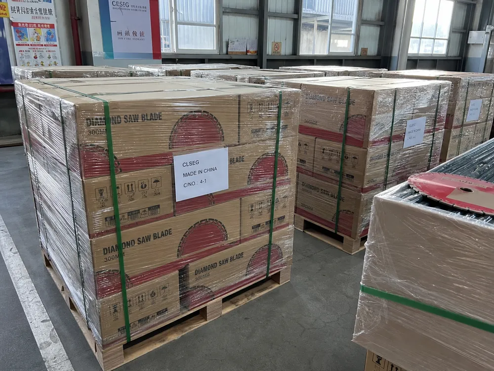 Stacked cartons of diamond cutting discs being prepared and labeled for container export shipment in a factory warehouse