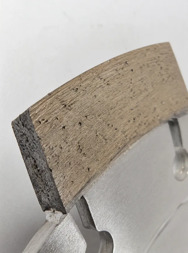 Close-up of dry cut diamond blade segment showing bond matrix and diamond distribution