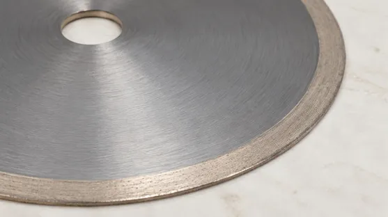 Close-up of continuous rim diamond blade showing uninterrupted diamond edge
