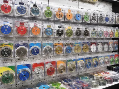 Diamond blade retail display with blister-packed products on peg hooks in hardware store