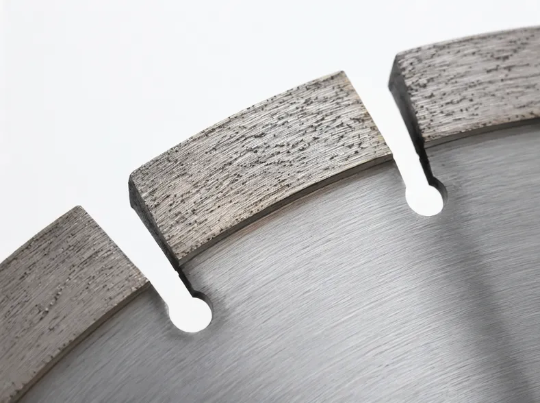 Close-up of open gullets on a segmented diamond cutting disc showing debris clearance channels