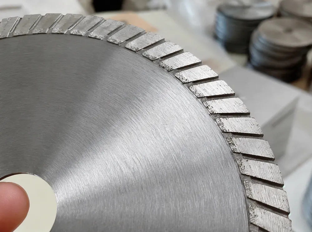 Turbo diamond cutting disc with serrated continuous rim — close-up showing the turbo rim geometry