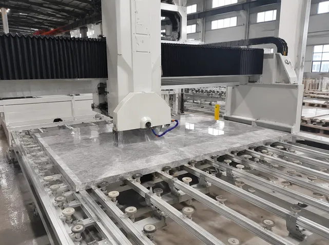 Automated CNC bridge saw processing large-format stone slabs on production line