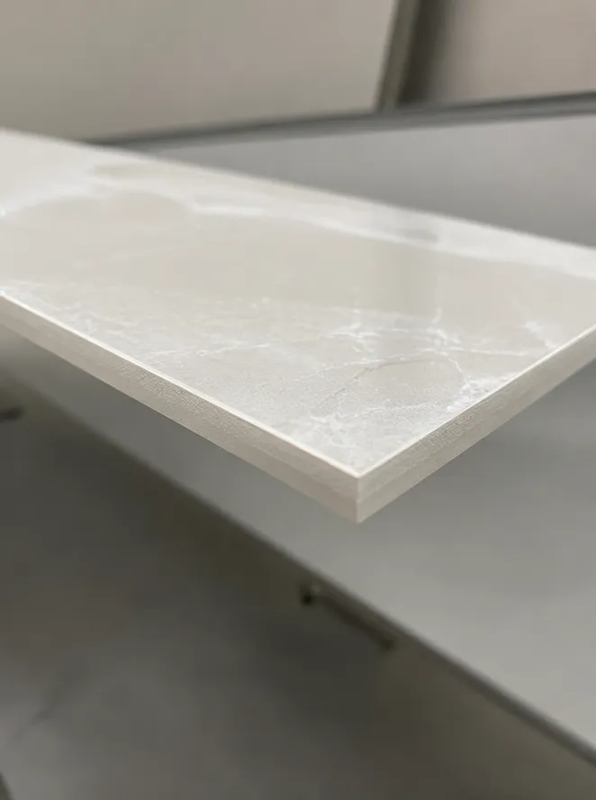 Close-up of a clean porcelain tile cut edge produced by a continuous rim ceramic diamond blade showing zero visible chipping