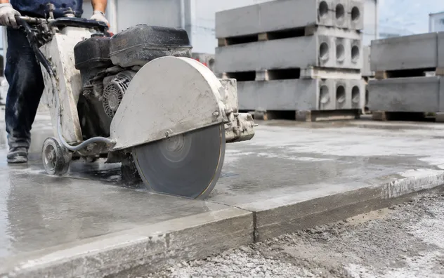 Cutting unreinforced concrete sidewalk slabs and precast panels with a standard diamond blade