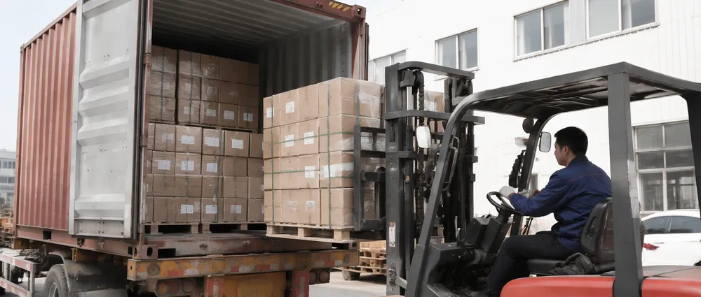Diamond saw blades packaged in reinforced cartons being loaded into shipping container