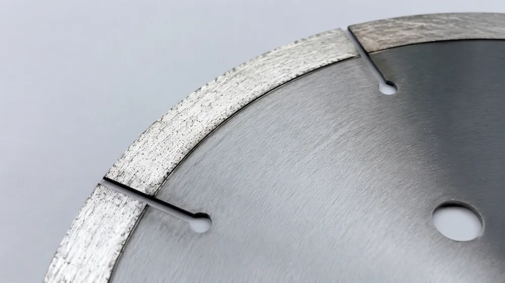 Close-up of CLSEG marble saw blade continuous rim segment showing narrow relief slot geometry