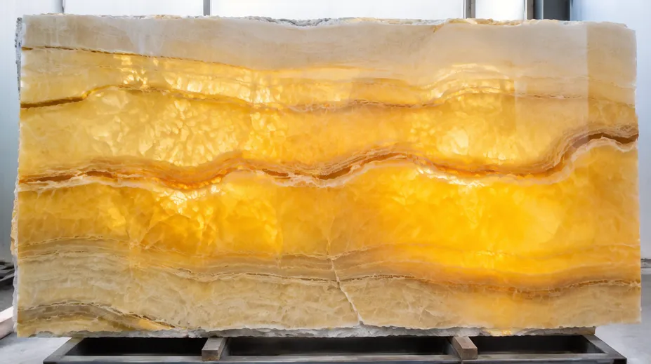 Translucent onyx stone slab with backlit amber tones revealing internal crystalline layers