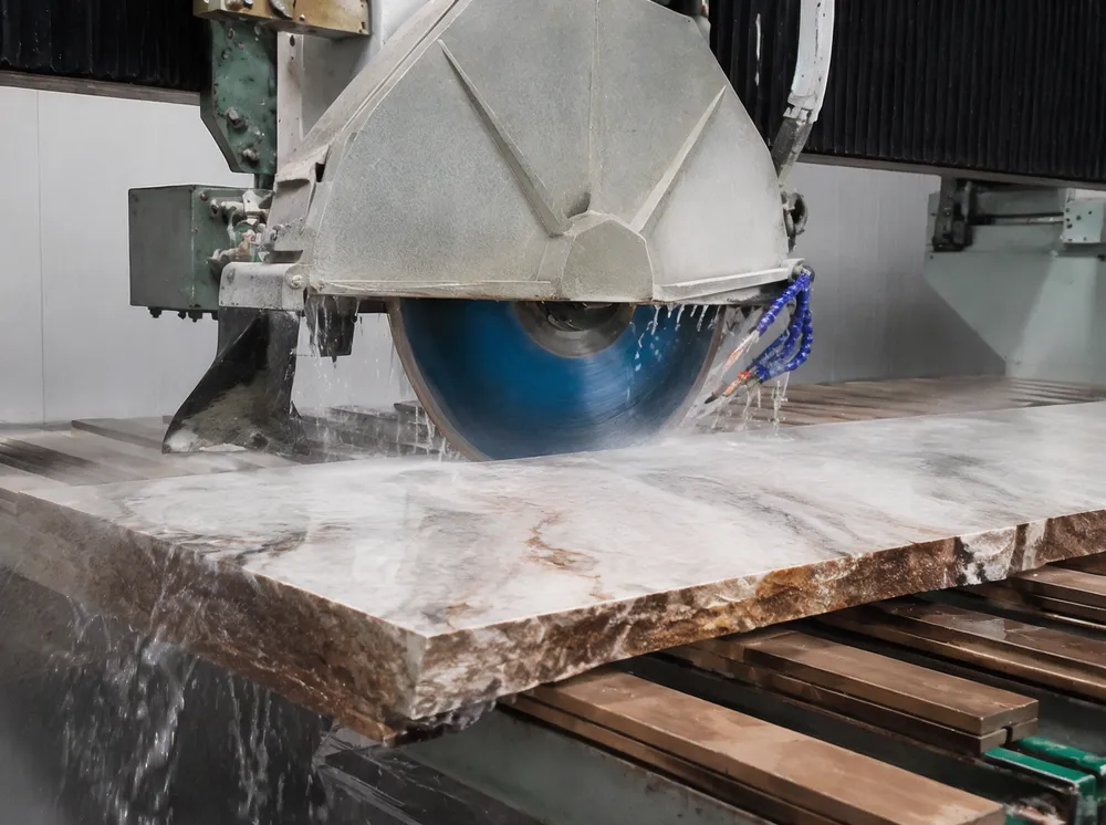 Quartzite saw blade sample being tested on a bridge saw during production validation