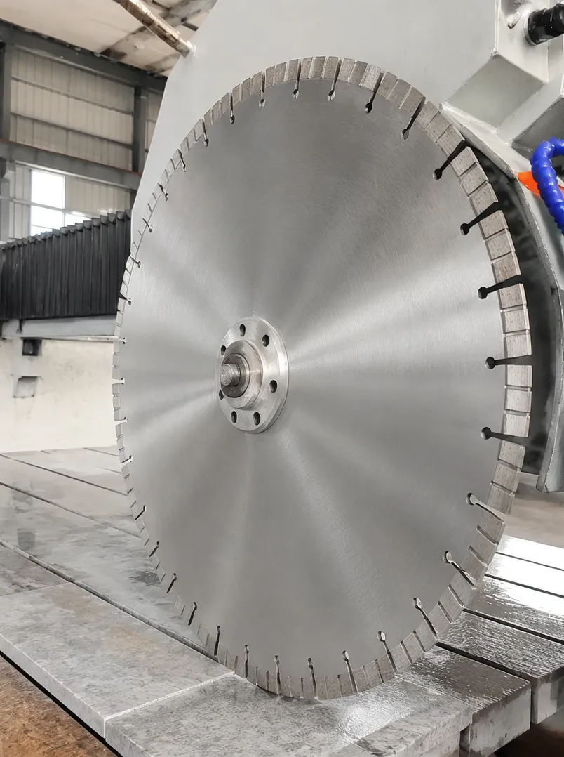 Quartzite bridge saw blade showing segment geometry and gullet design optimized for standard bridge saw water flow