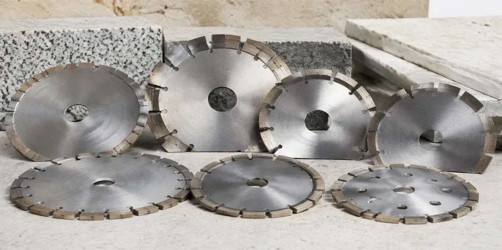 Custom diamond segments installed on various blade configurations for regional stone cutting applications