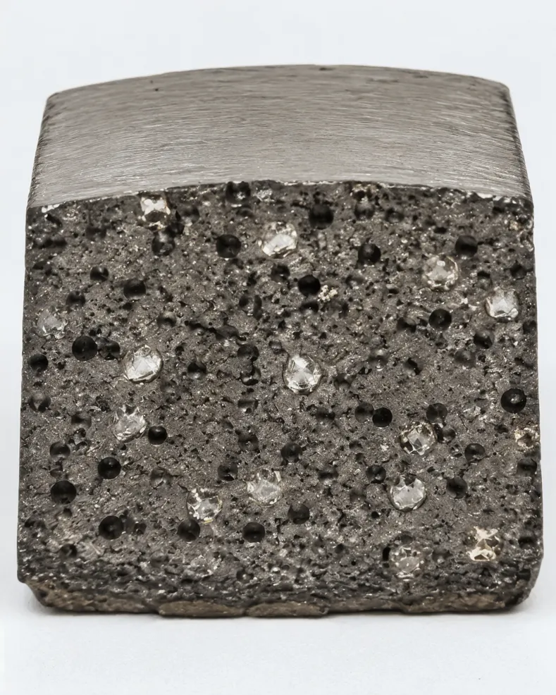 Cross-section of cobalt-dominant bond matrix showing engineered micro-voids for controlled diamond exposure in marble cutting