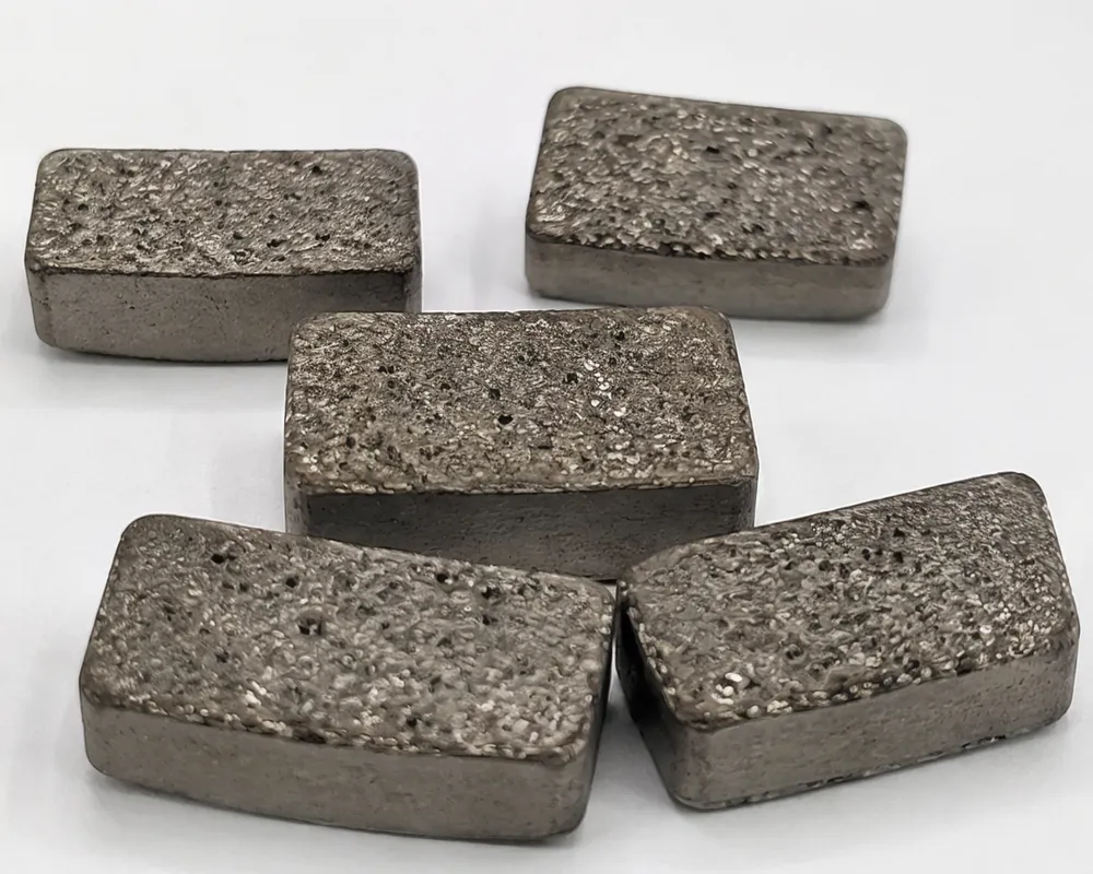 Marble diamond segments with cobalt-dominant soft bond matrix showing exposed diamond crystals